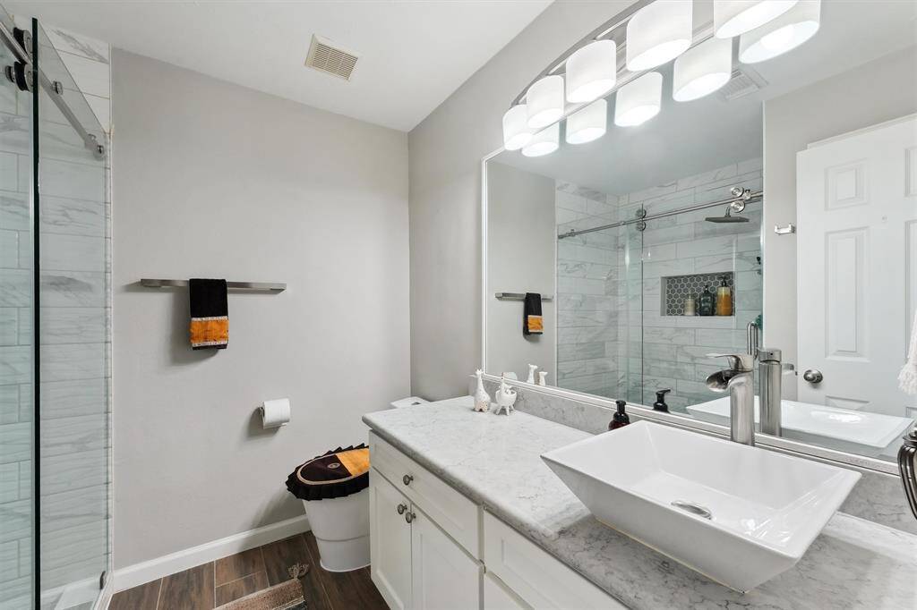 Upstairs updated bathroom with large shower.
