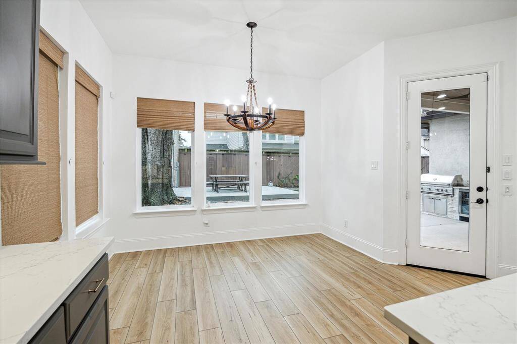 Charming breakfast room with backyard views.