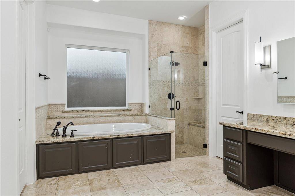 The primary bath features a soaking tub and a walk-in shower.