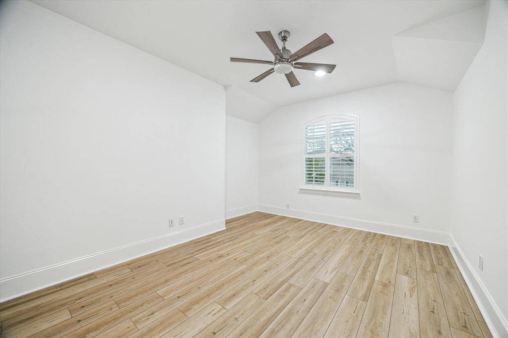 Upstairs bedroom with closet and shared bath.