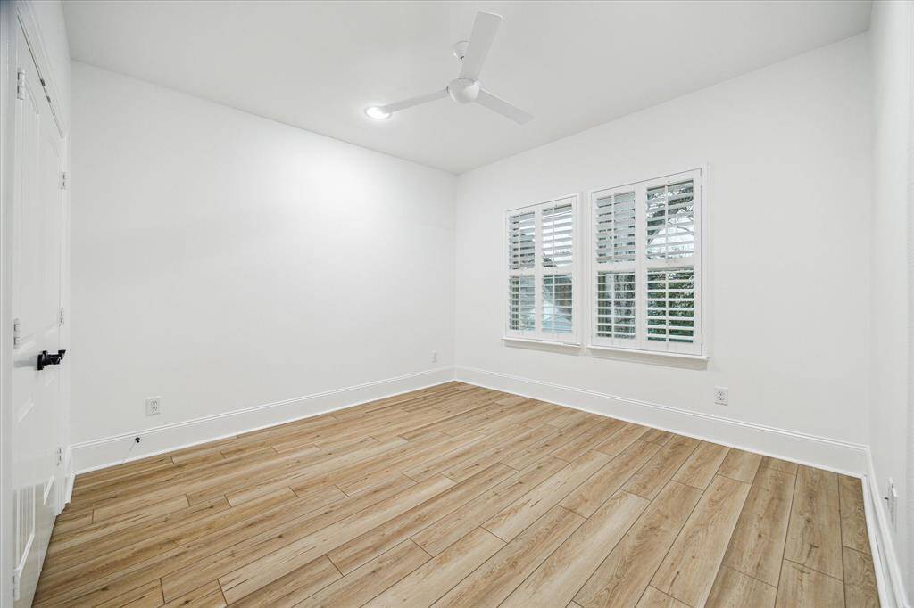 Upstairs bedroom with closet and shared bath.