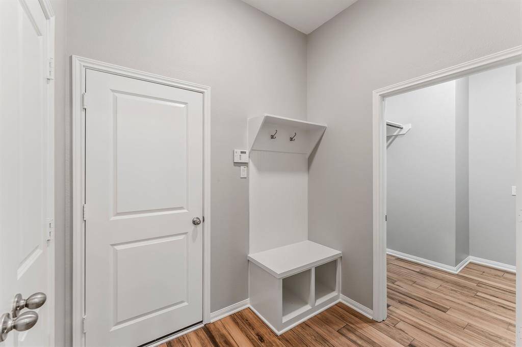 Practical mudroom off the garage, perfectly placed next to the laundry room for added convenience.