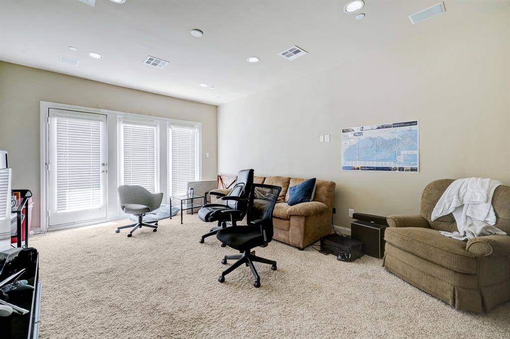 4th floor gameroom/flex room/study/or possible 4th bedroom with full bath and access to rooftop deck overlooking downtown.