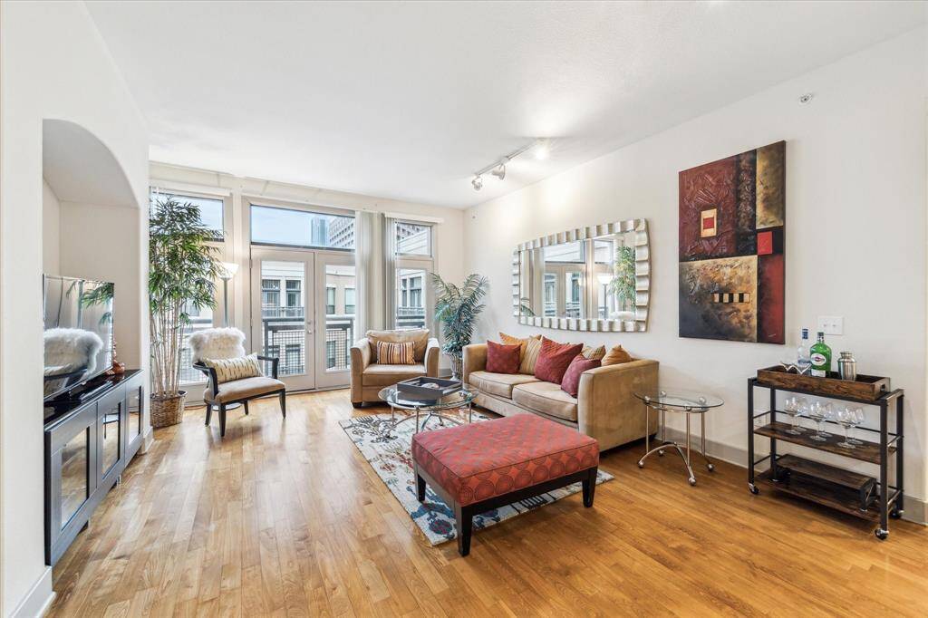 Bright and stylish living area with pool view, abundant natural light on the top floor