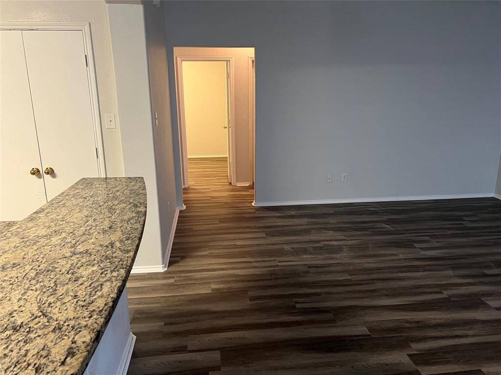 Hallway leading to secondary bedrooms and bathroom.