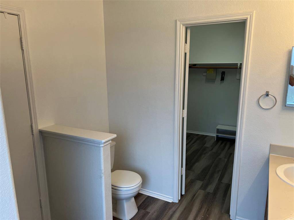 The primary bedroom large walk-in closet is just off the bathroom.