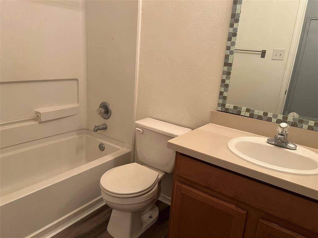 Secondary bathroom with full size shower and tub.