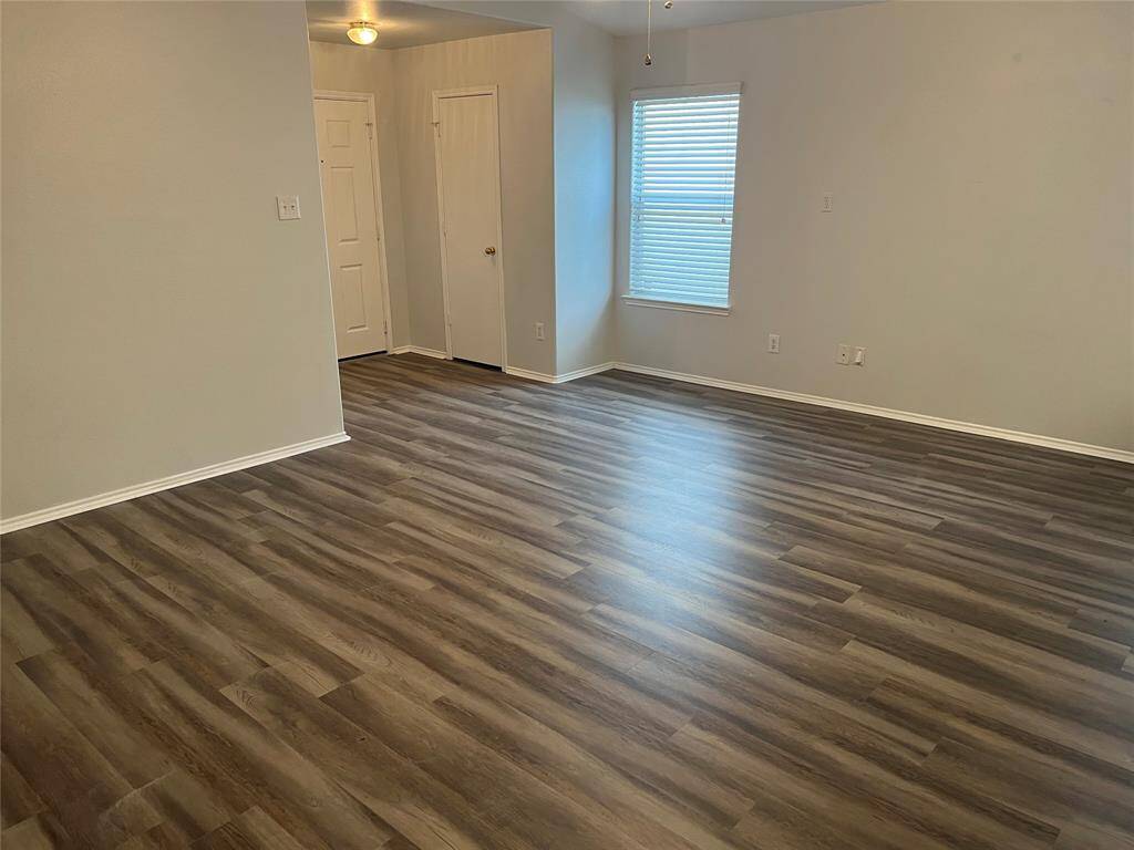View of living room looking back towards the front door.
