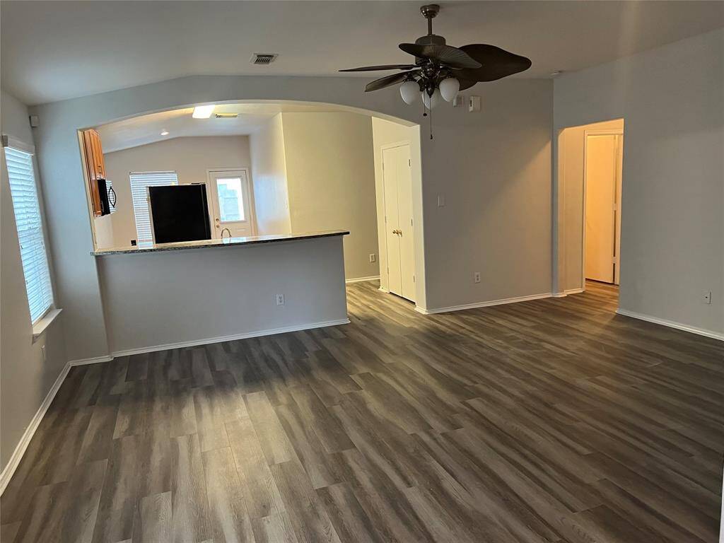 Living Room with view of arch entry kitchen beyond.