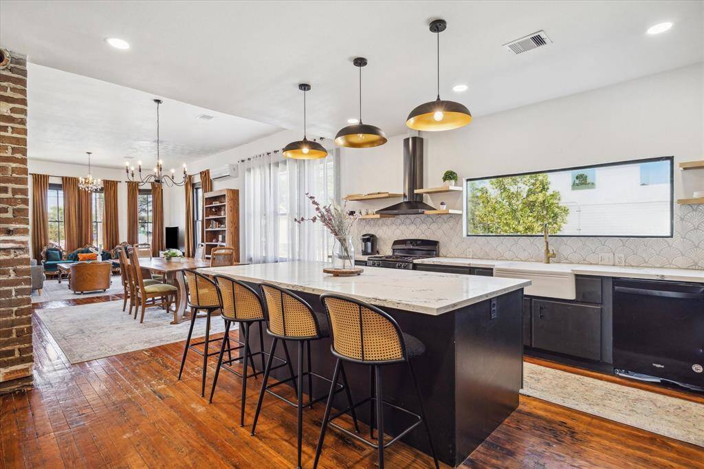 A view from the kitchen to the dining and living rooms