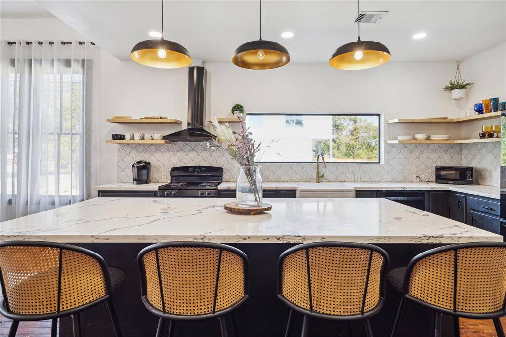 The kitchen has tons of prep space and storage