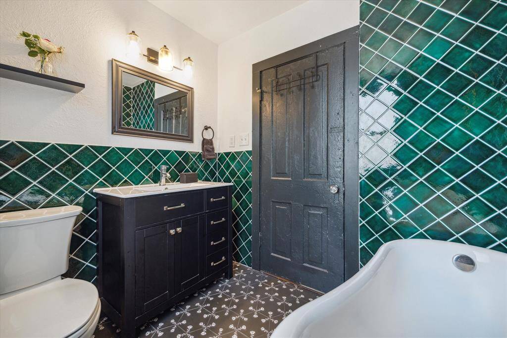This bathroom is located in a hall of of the foyer and is accessible to guests without entering through a bedroom