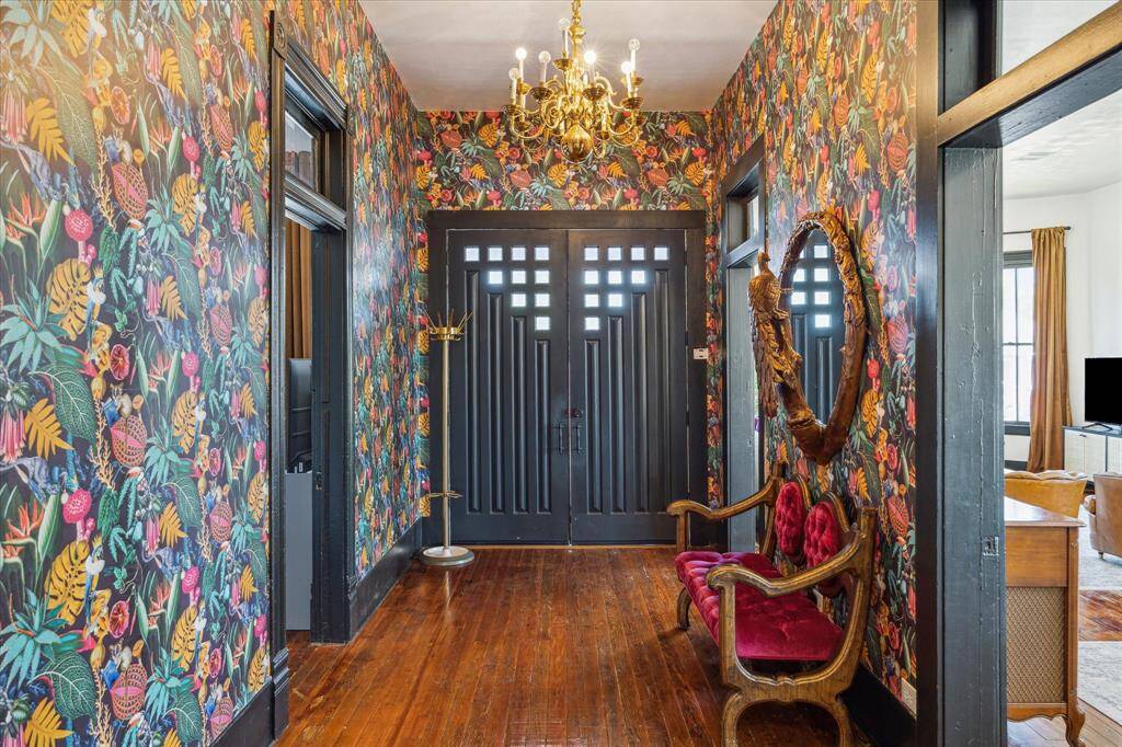 The foyer has been outfitted with designer wallpaper