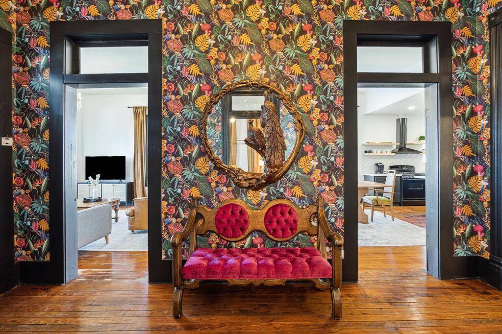Off the foyer are doorways to the living room and dining room
