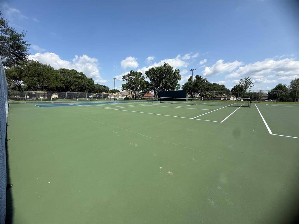 Spacious, well-maintained outdoor tennis court.