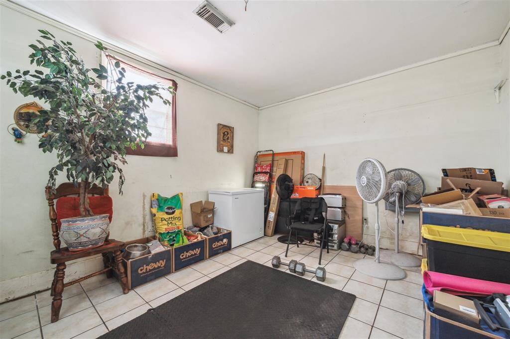 Versatile converted garage provides extra room ideal for storage, playroom, or home gym!