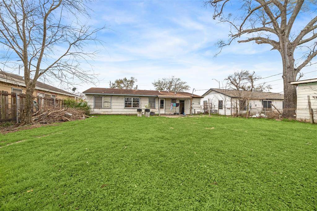 Large, fenced backyard perfect for your furry friends, a garden, or outdoor play.