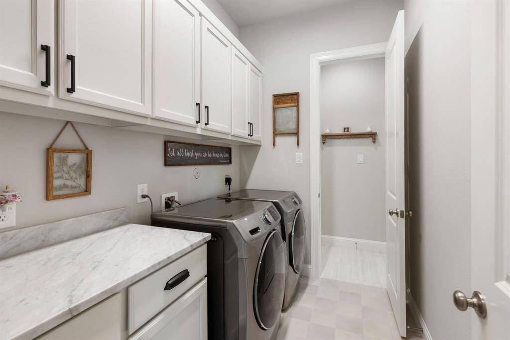 Go straight from the master suite to the laundry room so you don't have to travel far.  this opens up to the hallway where guest rooms 1 and 2 are located.