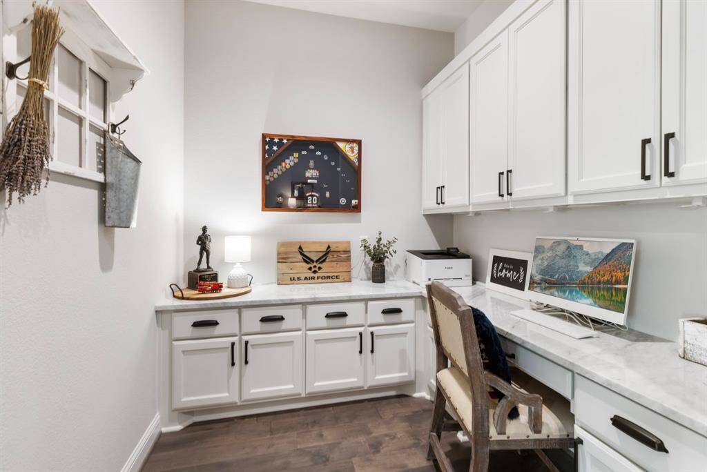 This is the "extra room"  It is a pocket office or zoom room.  Perfect to pay bills and keep the hosuehold organized, or if there are two work-from-home people in the home, or if you just need a quick place for a fast zoom call.  The counters are carrara marble in here as well.  Plenty of storage.