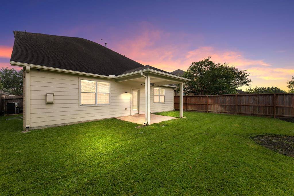 Come and see this spacious backyard with its beautiful covered patio. There is plenty of room for the kids to play and adults to relax!