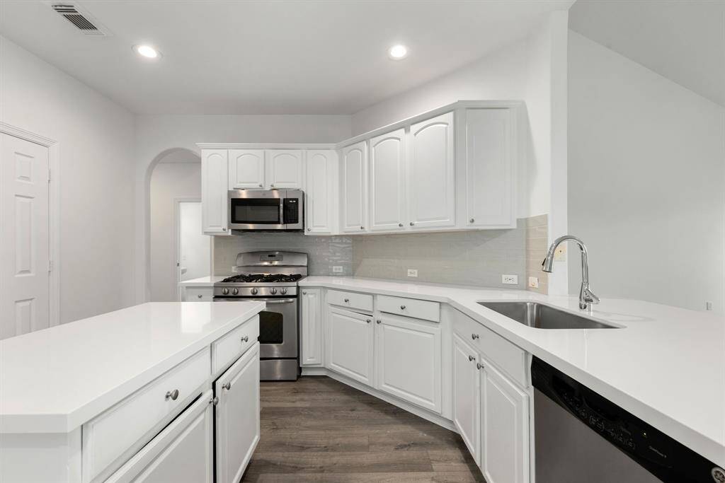 Any chef's dream, this stunning kitchen is perfect for everyday life as well as entertaining family and friends! Extra large kitchen island is perfect for conversation or that much needed space to lay out your party spread for everyone to enjoy! Large windows provide lovely views of your backyard and plenty of natural lighting throughout the day.