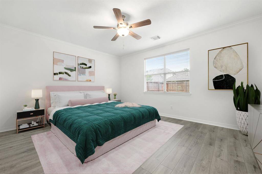 What a wonderful place to come home to, this stunning primary suite greets you with gorgeous luxury vinyl plank floors, fresh paint, high ceiling, ceiling fan with lighting, lovely windows with blinds allowing in natural light brightening up this spacious primary bedroom, with extra space for a seating area.