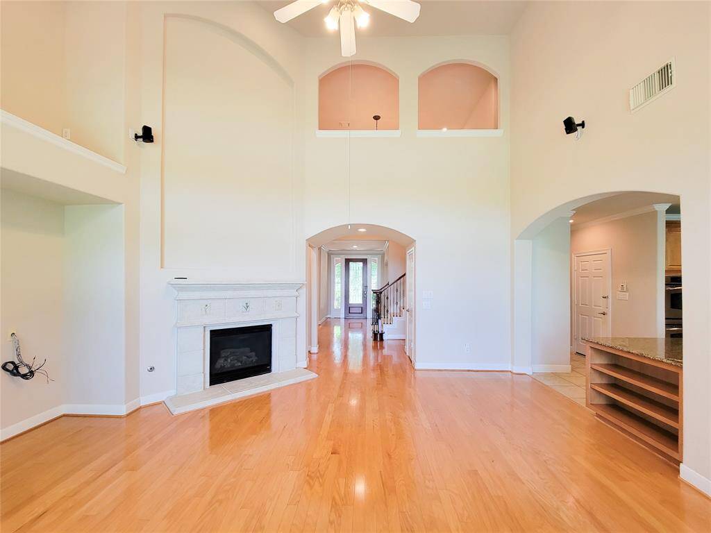much natural light in the living room with extra high ceilings