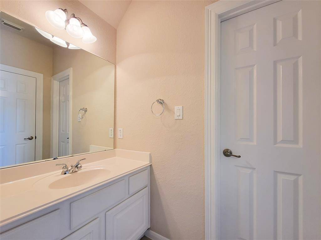 spacious laundry with room for extra fridge and extra freezer