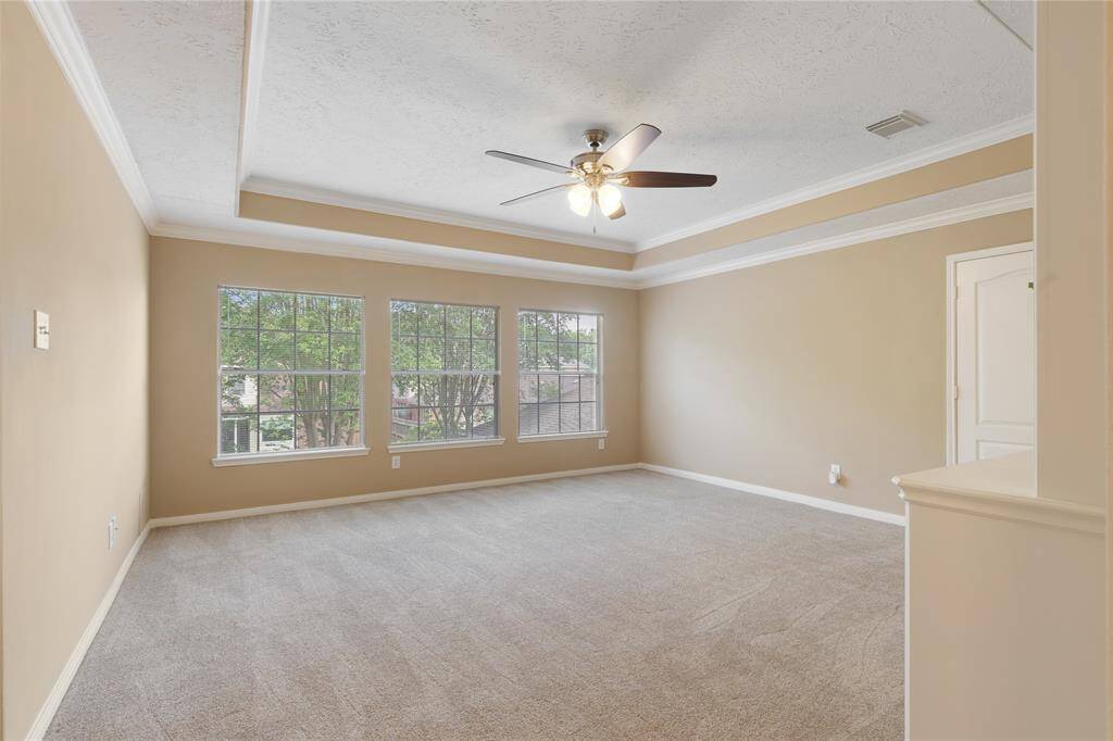 There is a large game room with the new pet resistant carpet, and a trayed ceiling with a ceiling fan for your comfort