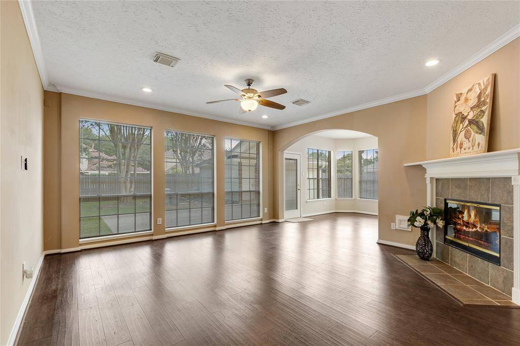 The den is bright and airy with a gas/ wood burning firdplace and beautiful pergo Outlast  laminated wood waterproof floors throughout the downstairs