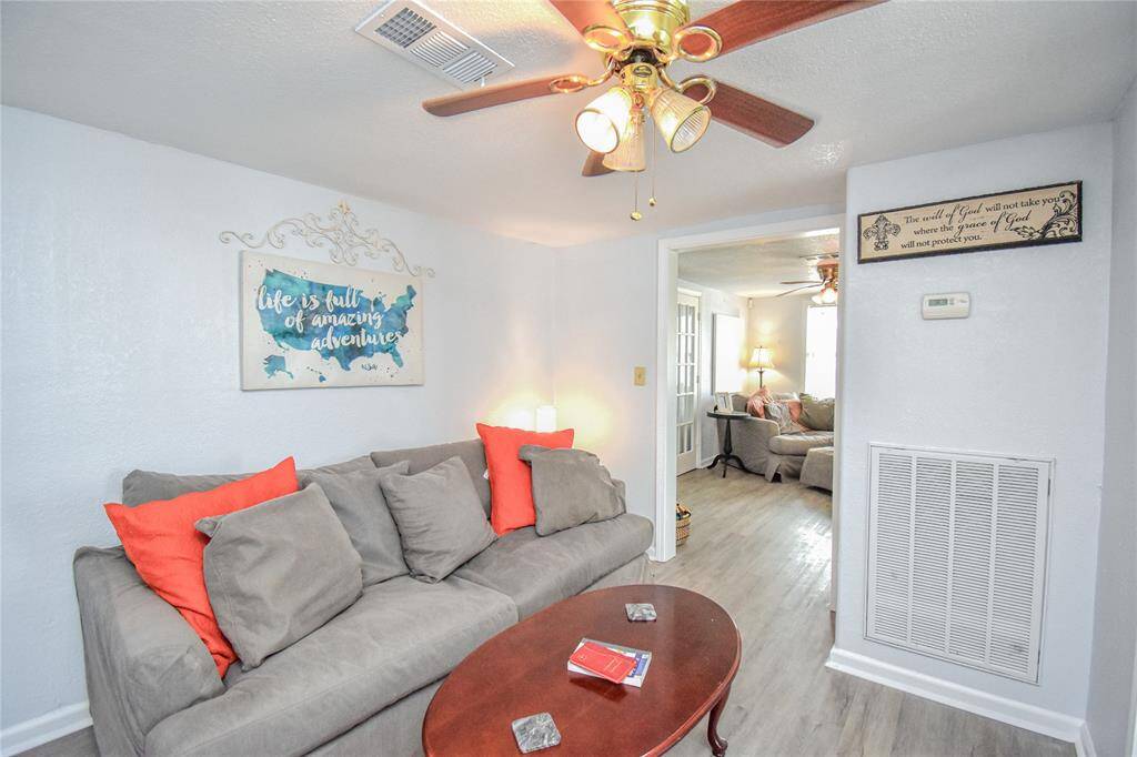 Centrally located, this versatile room is perfect as a cozy sitting area, reading nook, or central hub for gathering and relaxing- bringing everyone together in the heart of the home.