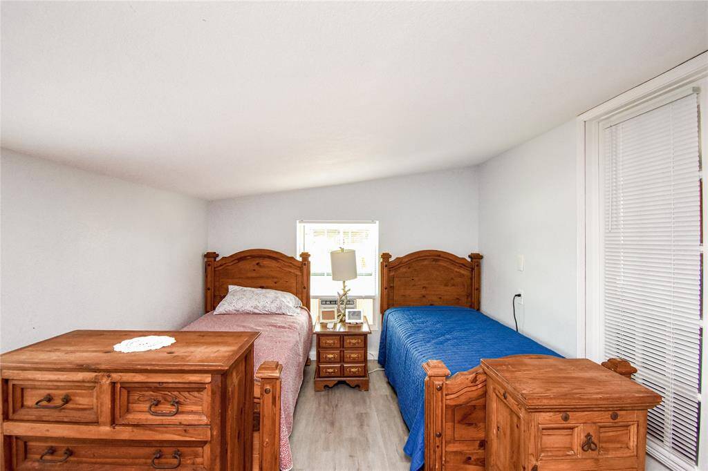 This spacious flex room features the same updated flooring and fresh paint found throughout the home- ideal for a home office, hobby space, guest room, or whatever fits your needs.