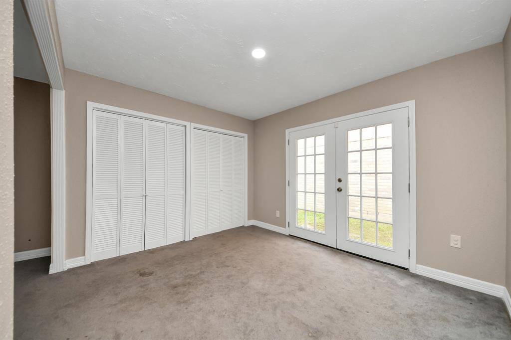 Bedroom 1 with access to backyard.