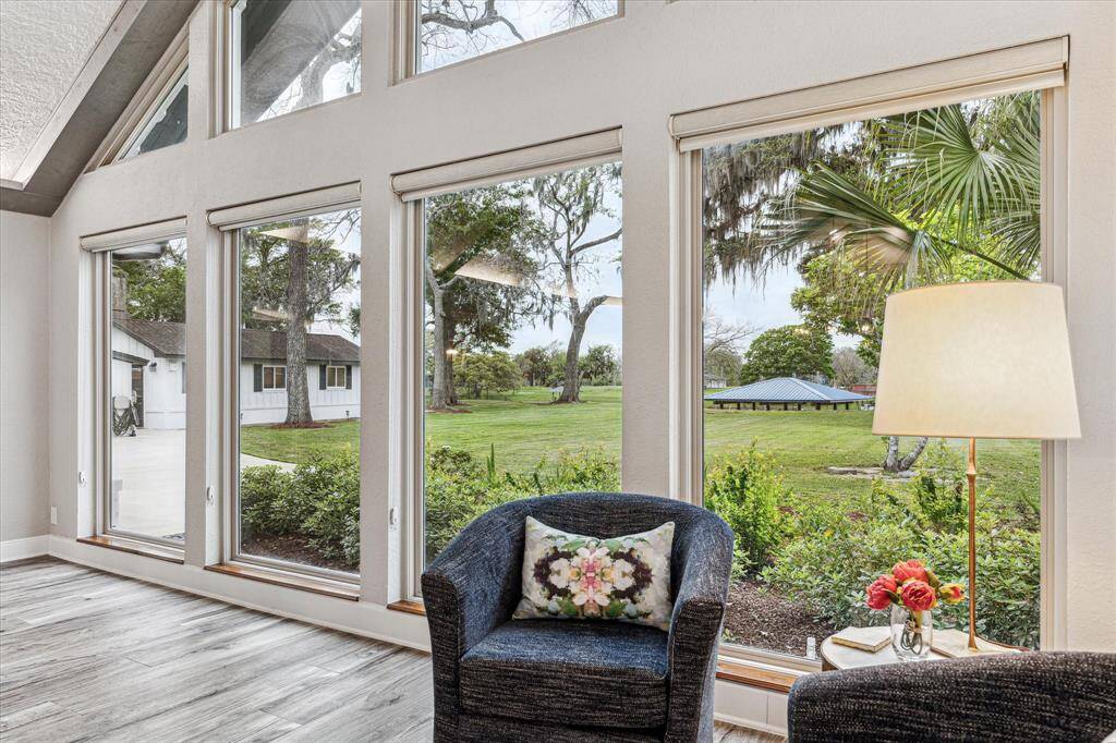 Oversized stacked windows line the back wall of the living area providing amazing views of the yard and river behind the home.