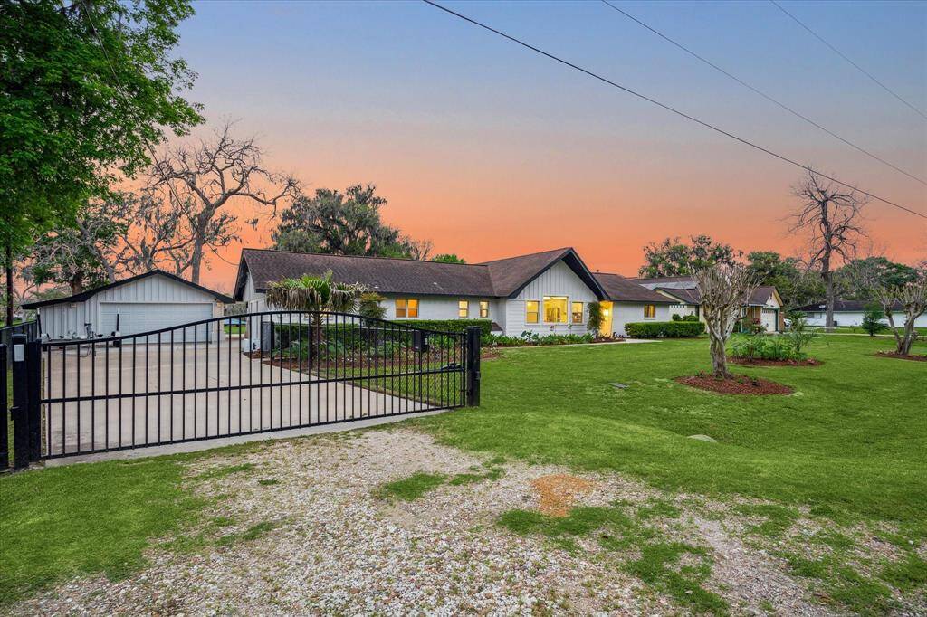 Enter this fabulous waterfront estate through a private driveway gate to find an extended driveway, extra parking pad, and a two-car garage.