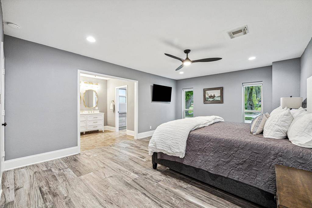 This incredible home offers two primary suites, each with ample closet space and an updated ensuite bathroom.