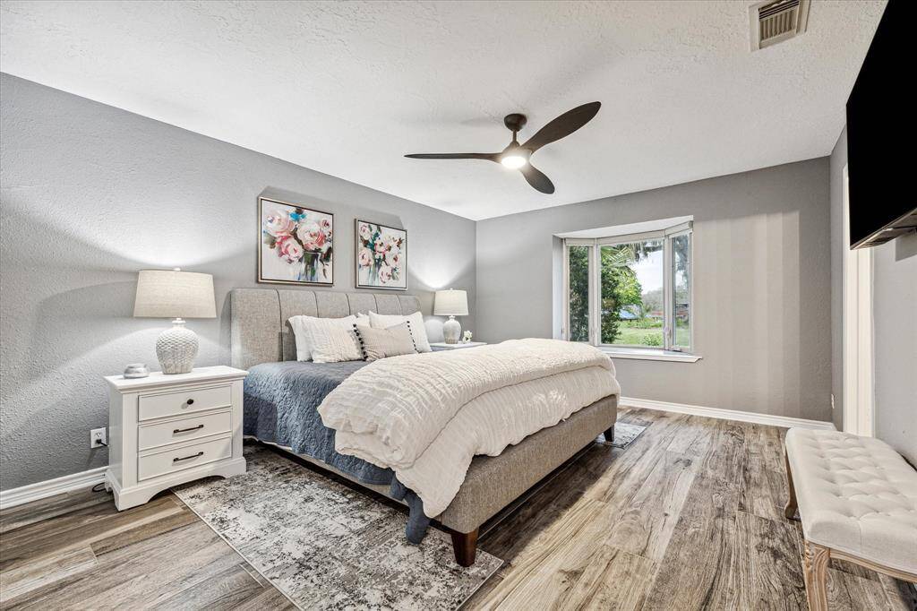 Your guests will have sweet dreams in this  retreat. Find beautiful flooring, fresh paint, a modern lit fan, casement windows, a large closet and a beautifully updated ensuite bathroom.