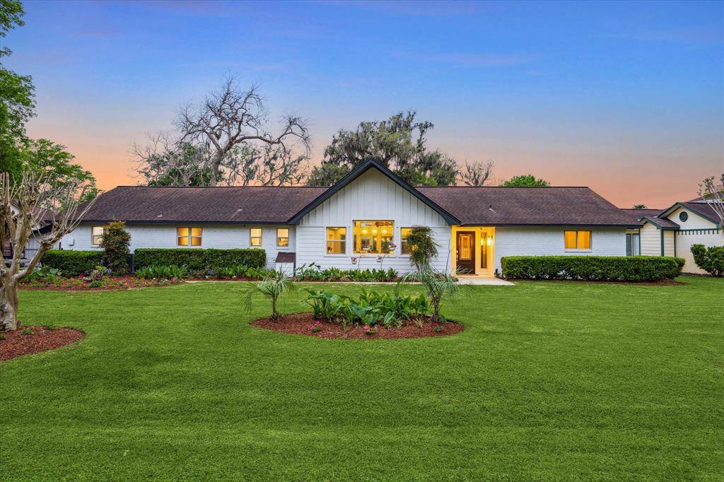 Absolutely stunning inside and out! This amazing river front home offers a dramatic open floor plan, guest quarters, a covered patio with a stainless steel grill, an extended patio, and a boat lift and dock.