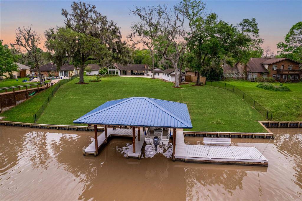 Picture yourself enjoying the tranquility of fishing from the convenience of your backyard dock, with the San Benard River gently flowing just steps away. Equipped with a boat lift and slip, your waterfront property offers effortless access to all the fishing you can stand.
