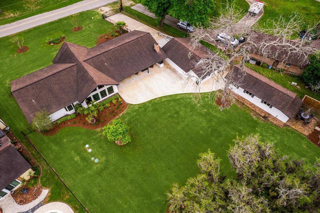 This fabulous property offers a very long list of improvements both inside and out. From landscaping to lighting, flooring to fresh paint, renovated bathrooms, updates to kitchen, guest quarters, the lift system for boat dock, fencing, and so much more. Come see for yourself!