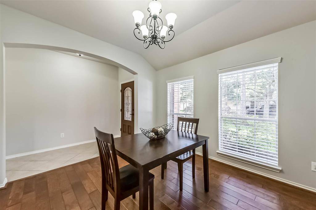 The dining room offers two large front-facing window adds warmth and light. A versatile space that can easily double as a home office or flex space.