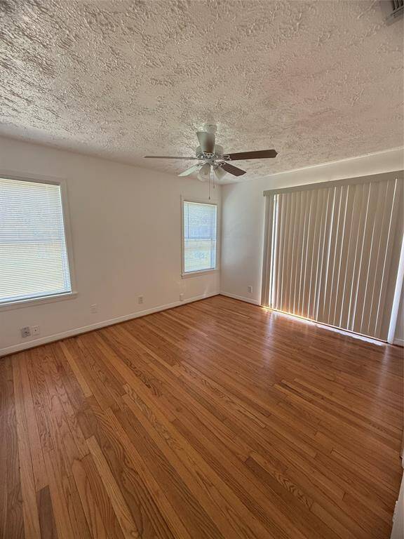 Primary bedroom has door going out onto a side porch area