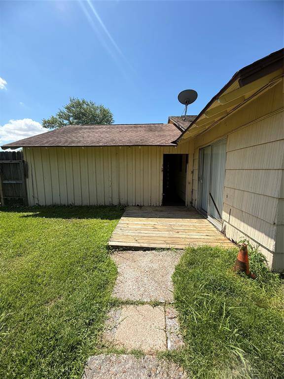 Side porch off primary and back entry to shop
