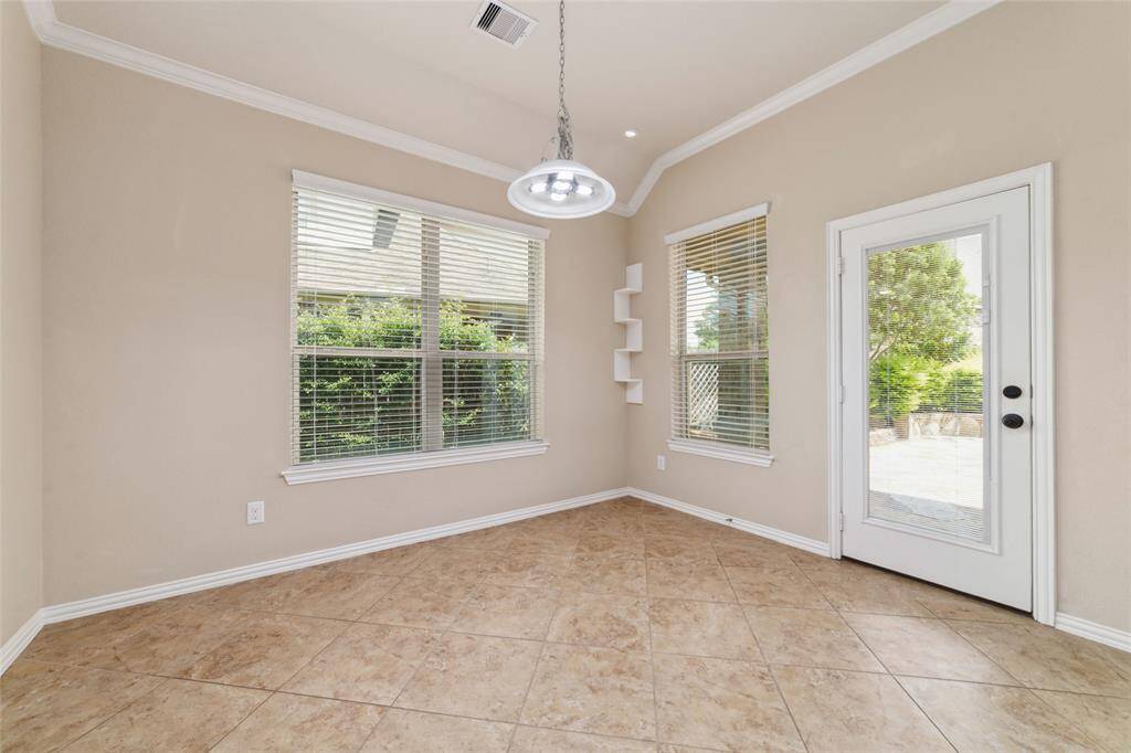 Breakfast room w built in decorative shelf and again another view of your beautiful patio.