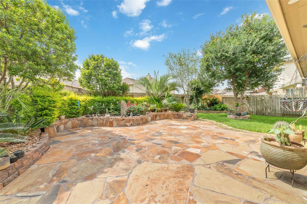 Stunning backyard with extended patio and lush garden!