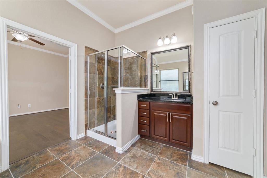 Separate shower and two vanity areas.