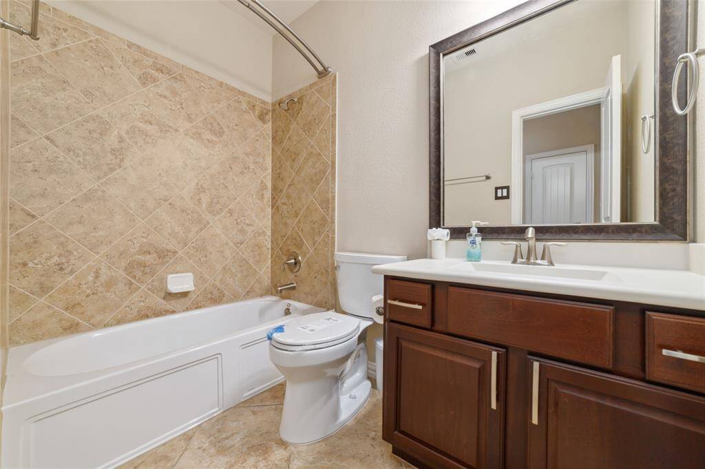 One of the two secondary bathrooms.