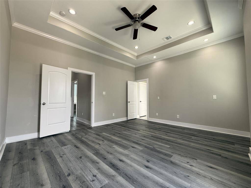 Alternate view of the primary bedroom. Recessed reading lights are individually controlled.