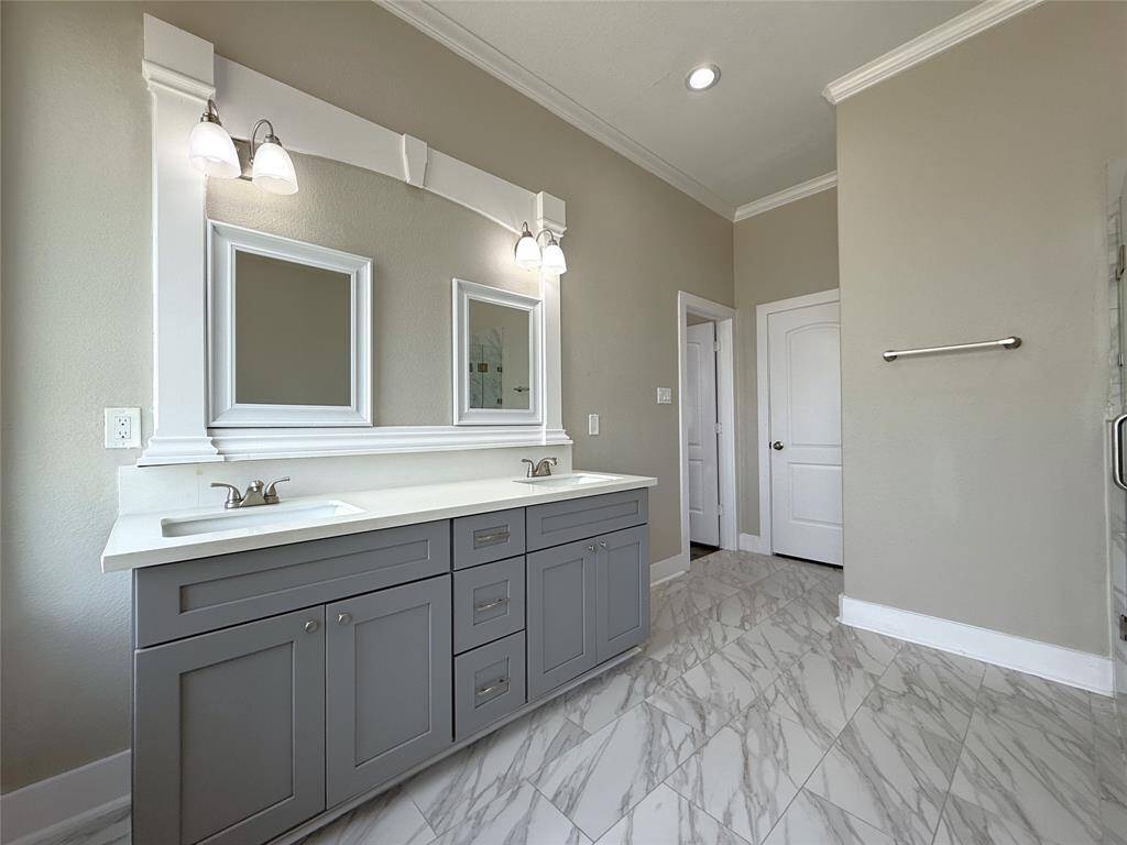 The double sink vanity offers ample storage.