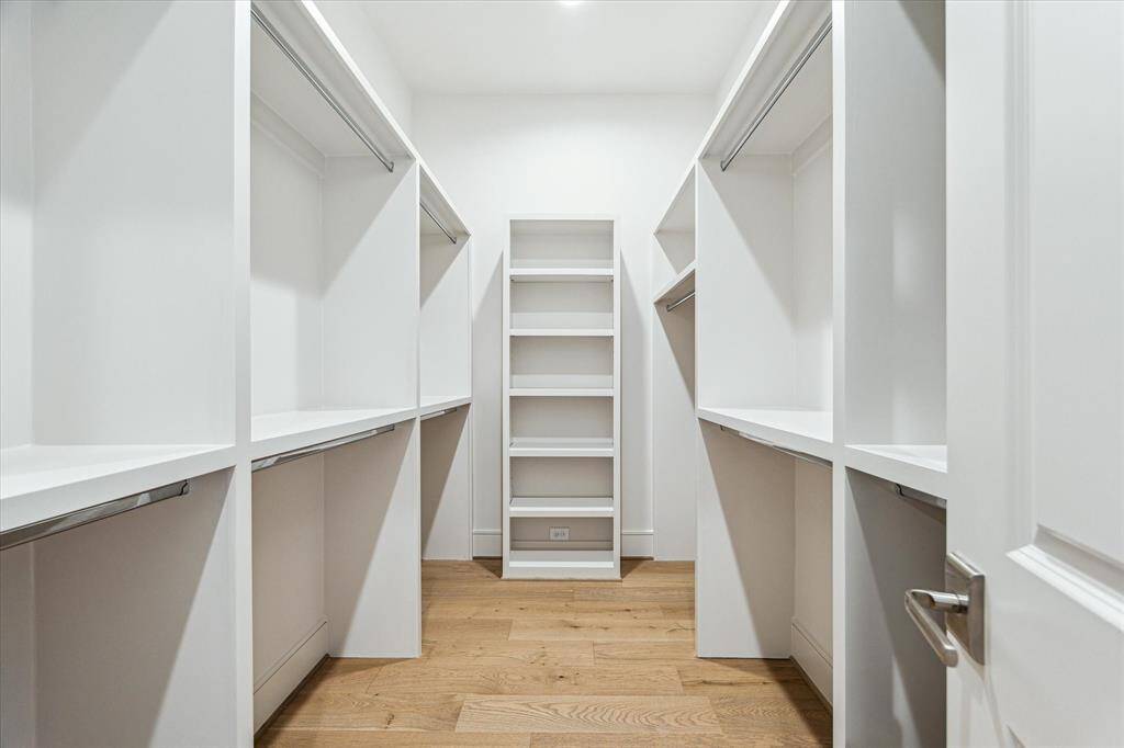 His walk-in closet in the primary suite.